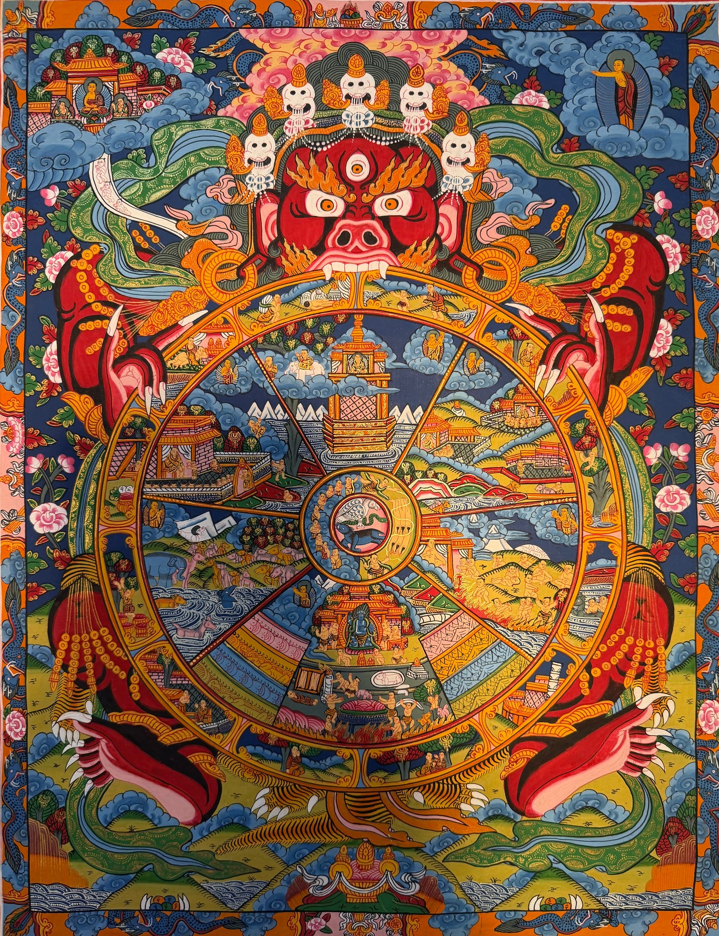 Colorful Thangka painting with Wheel of Life mandala and multi-headed deity center
