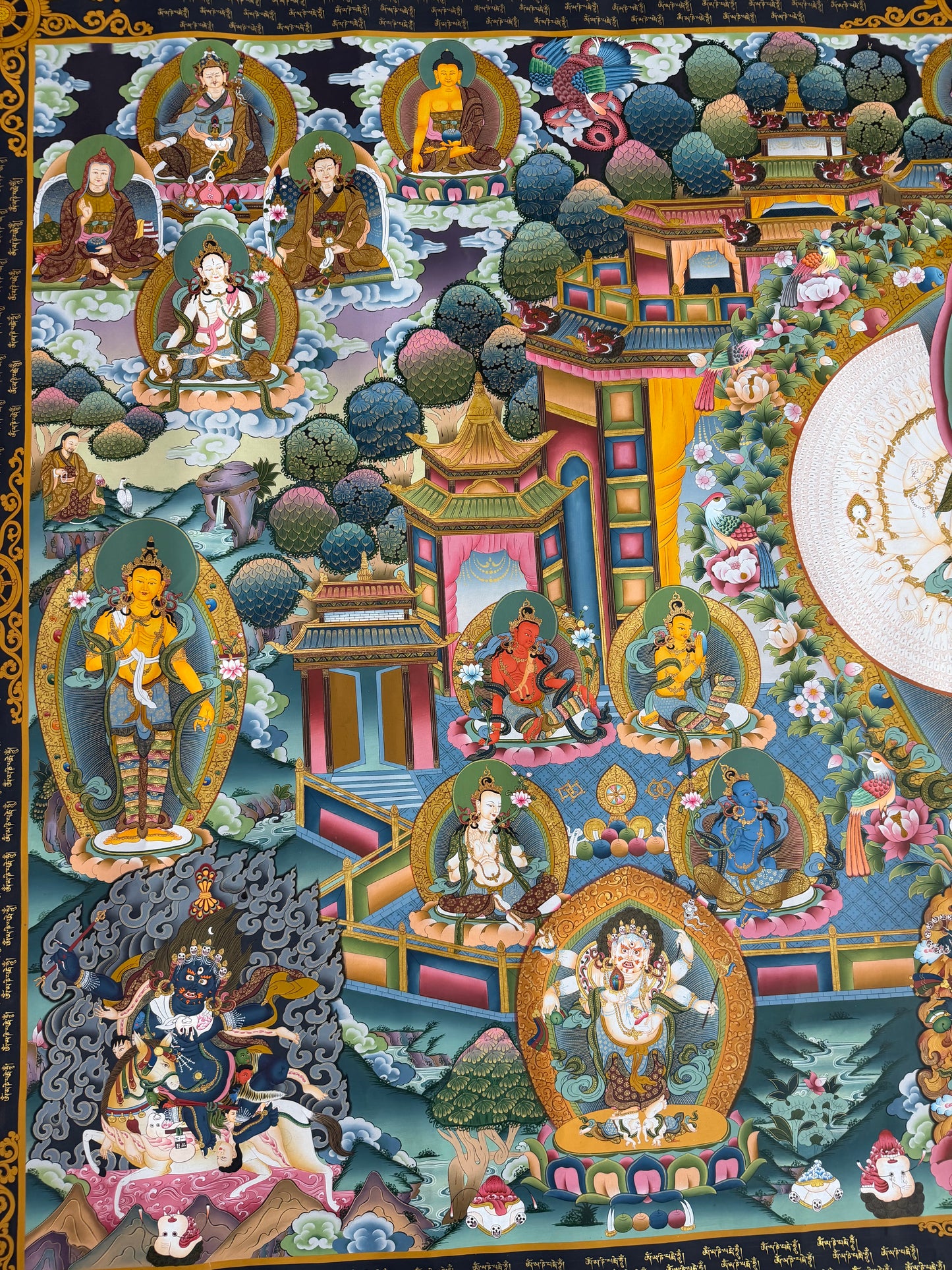 Avalokiteshvara thangka painting with temple scene and multiple framed Buddhas, cropped right