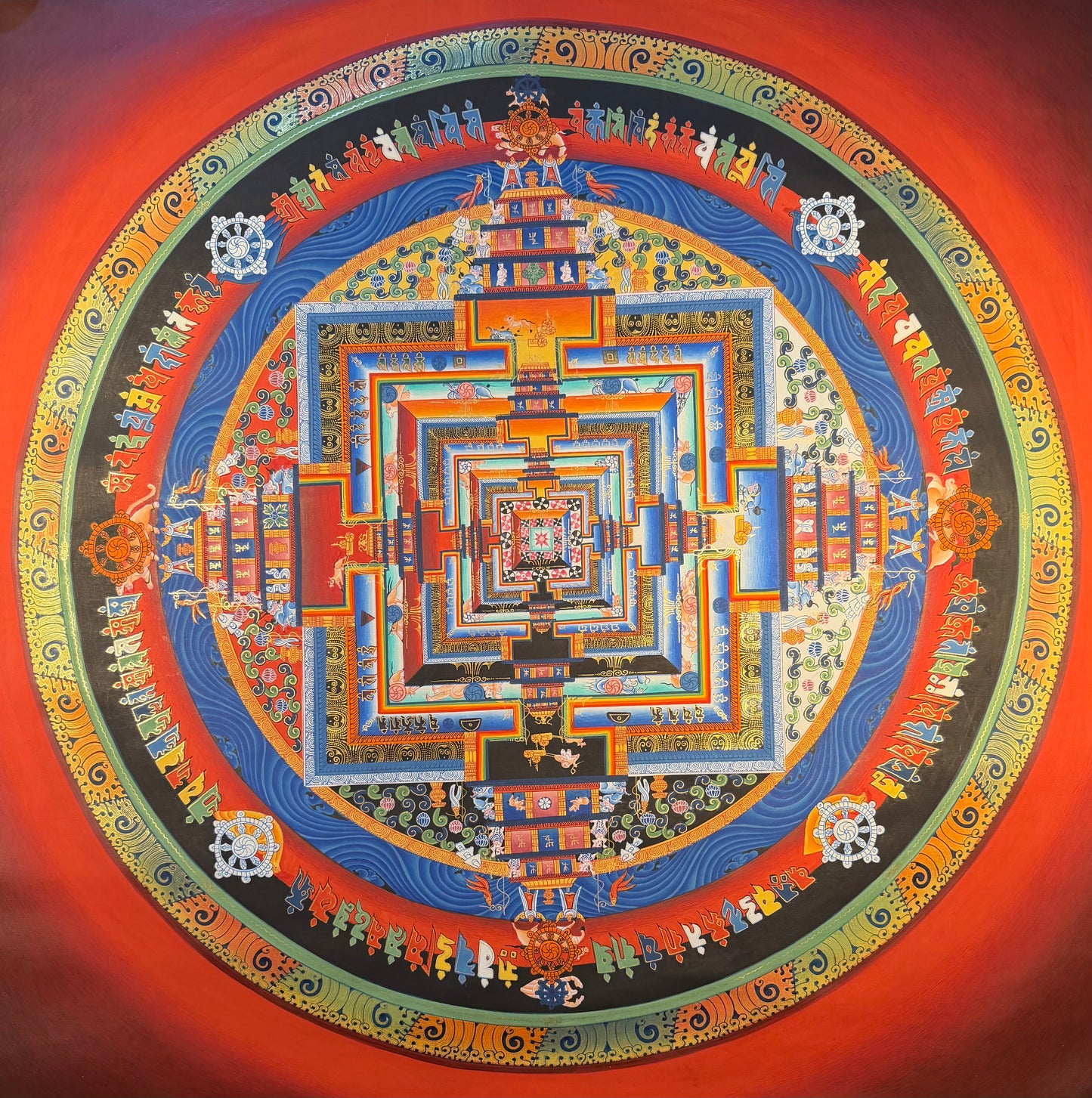 Kalachakra mandala thangka painting, circular geometric design with blue, orange and red details