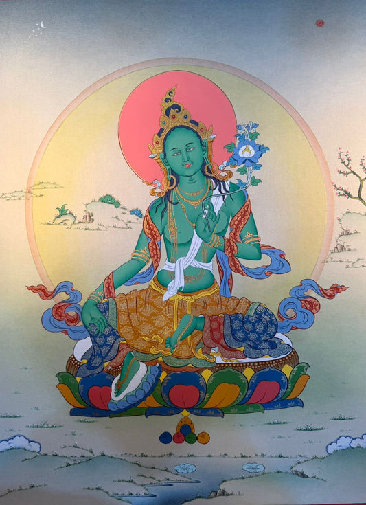 Thangka painting of Green Tara seated in ornate robes, halo behind, holding a flower