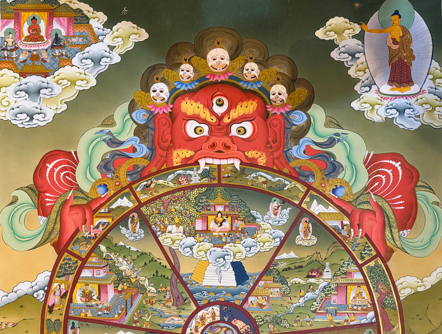 Thangka painting with central demon head above a circular mandala of scenes