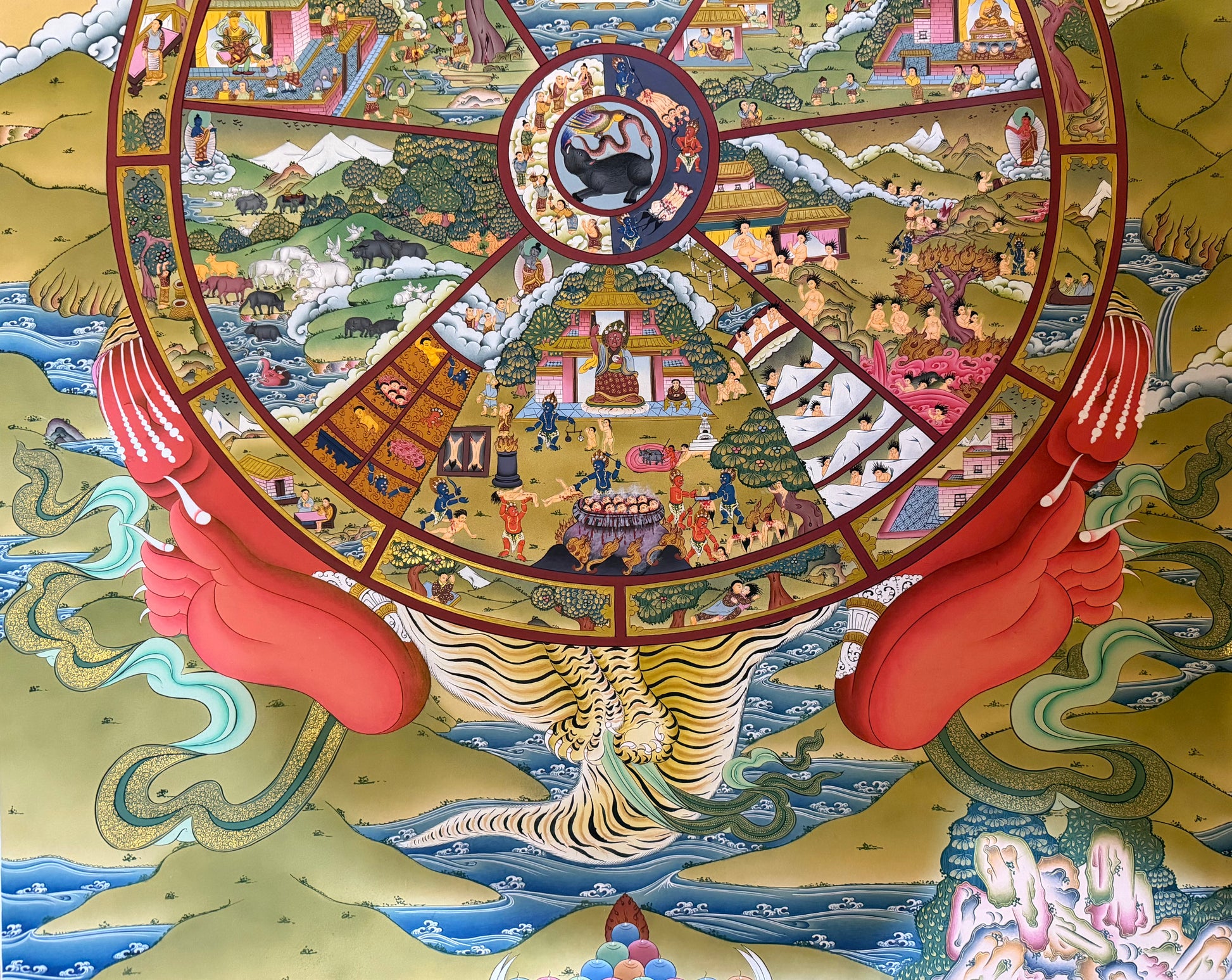 Circular thangka mandala with red border, small figures, and red claw-like protectors