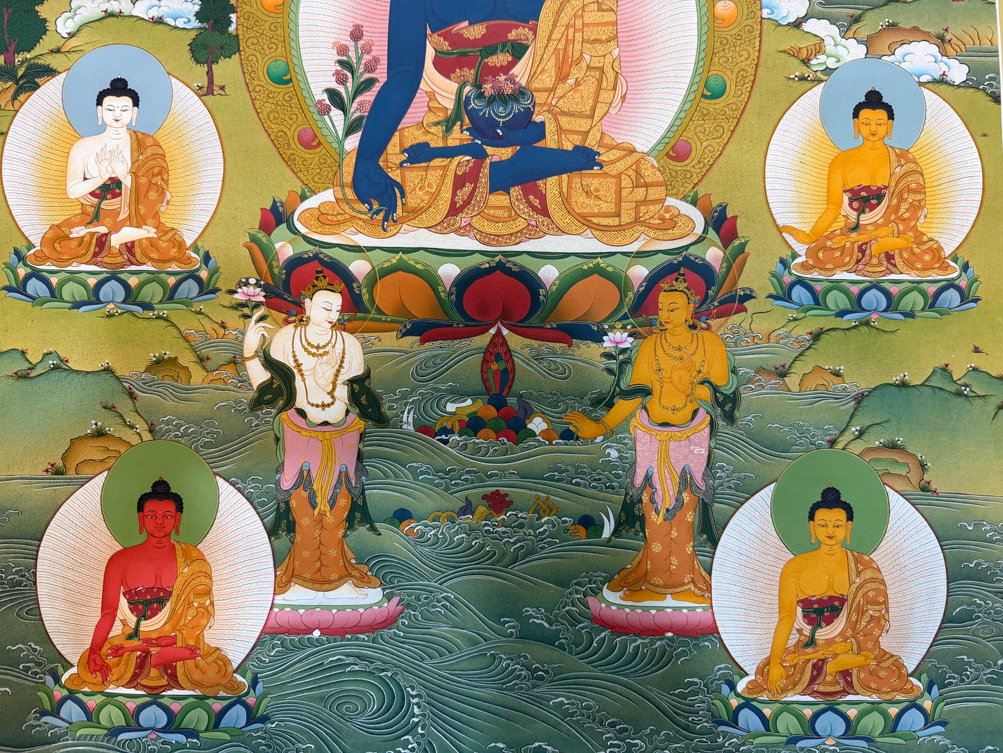 Medicine Buddha thangka painting with four seated Buddhas around blue central figure, waves and lotus