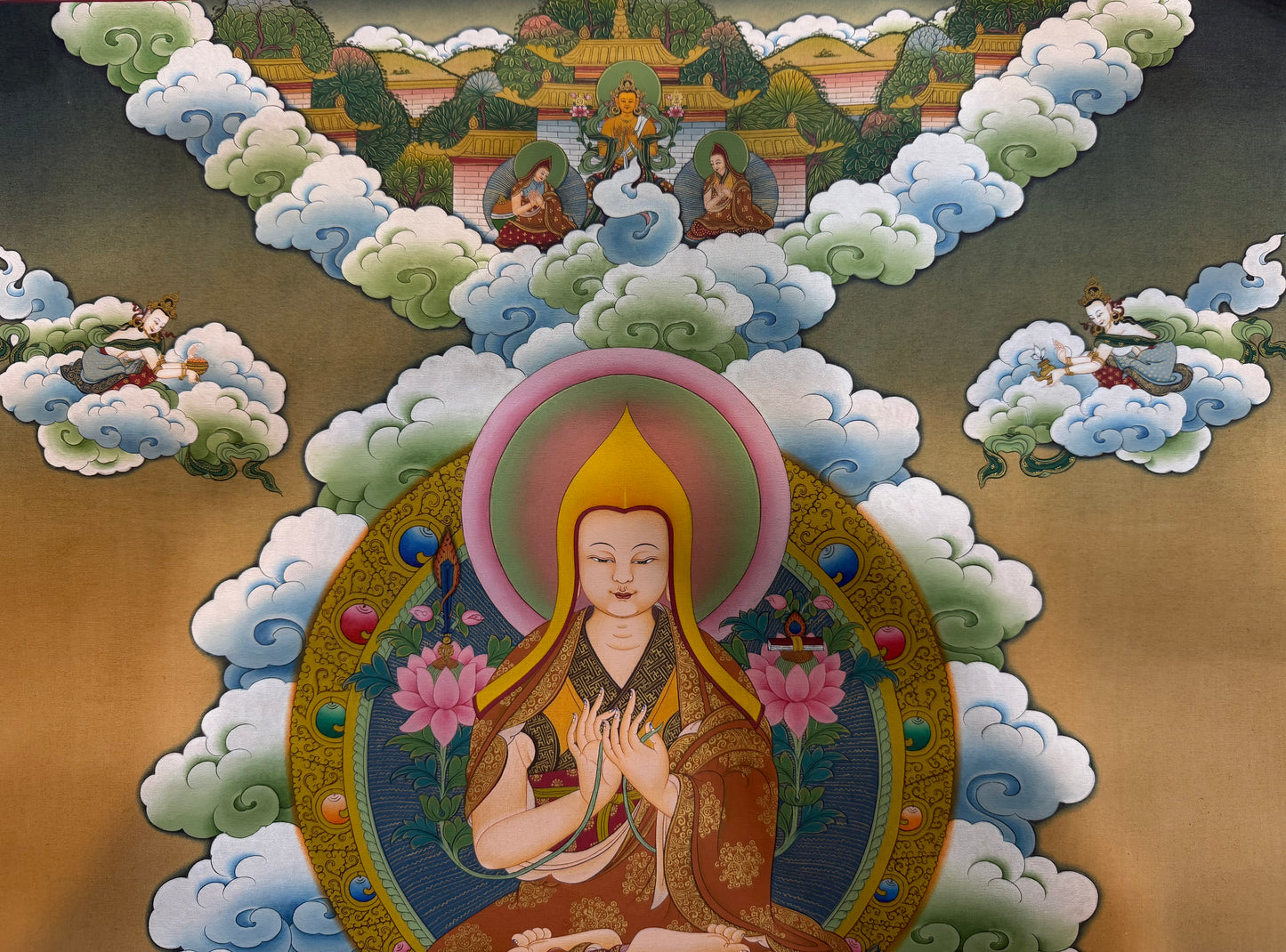 Je Tsongkapa thangka painting close-up of seated Buddha in a glowing halo with clouds