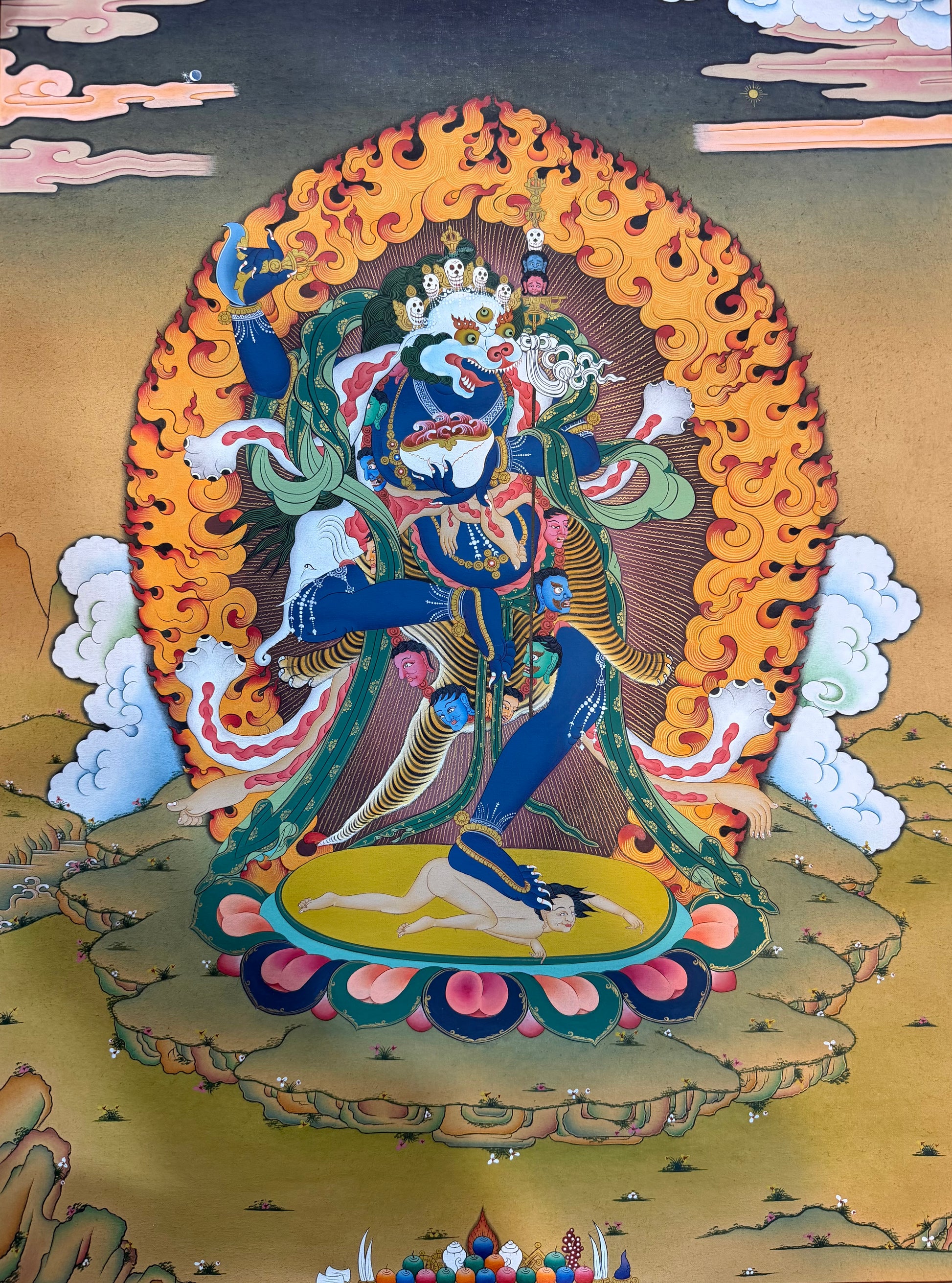 Simhamukha thangka painting with seated lion-faced deity in ornate frame