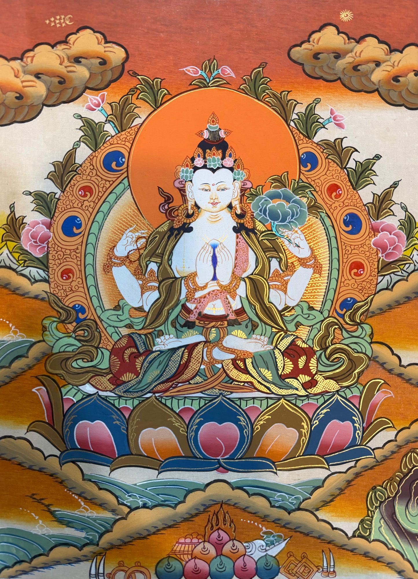 Chenrezig thangka painting of seated blue deity with halo, lotus seat, ornate flowers