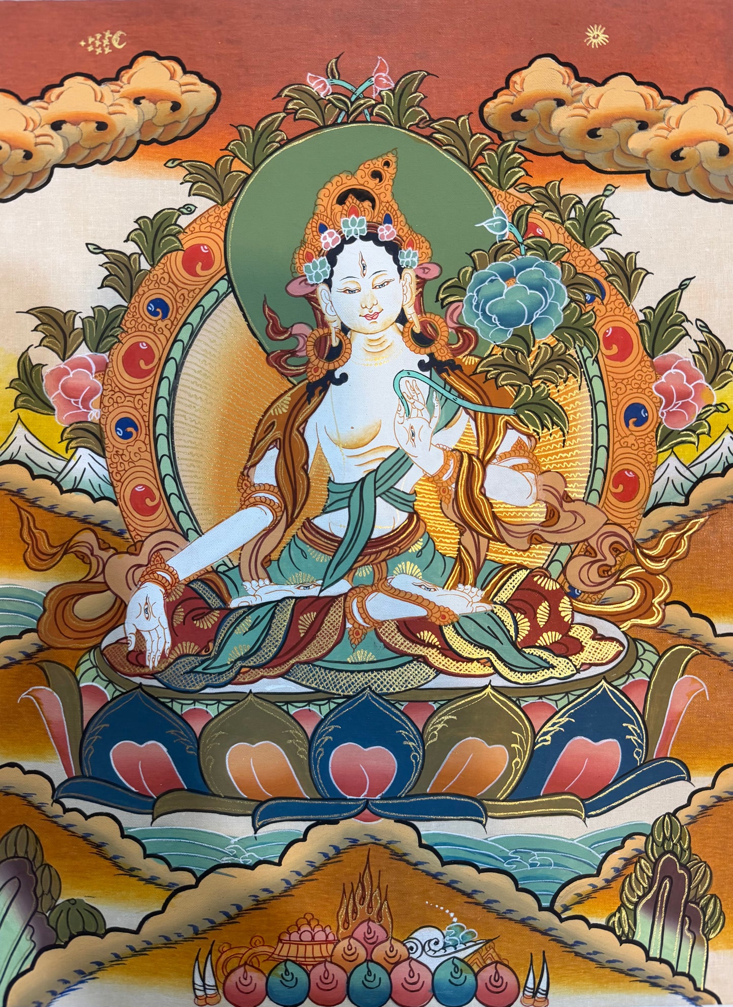 Thangka painting of seated Tara deity with green halo, lotus base, clouds and candles