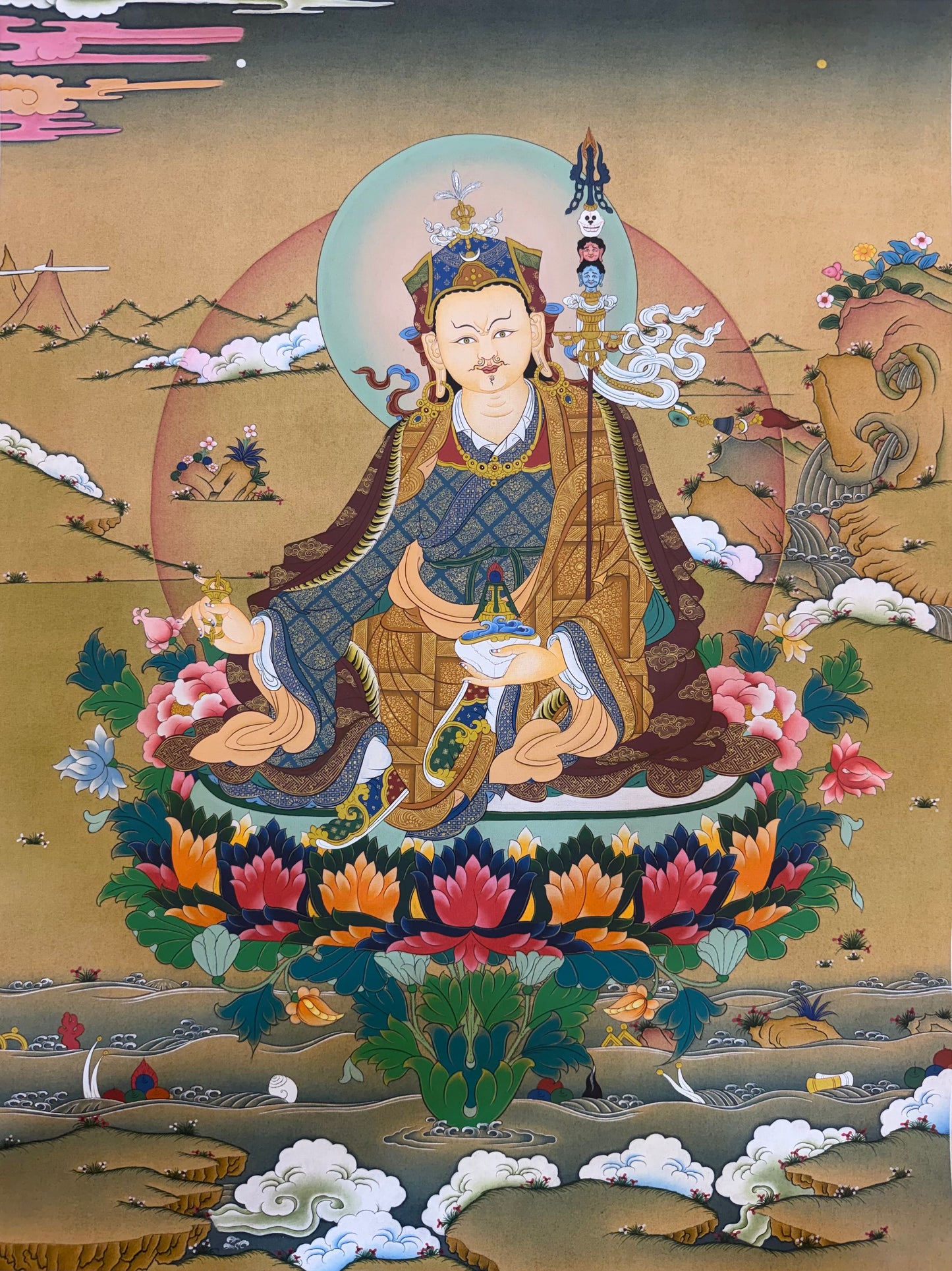 Buddhist thangka painting of seated Guru Rinpoche with ornate halo and flowers