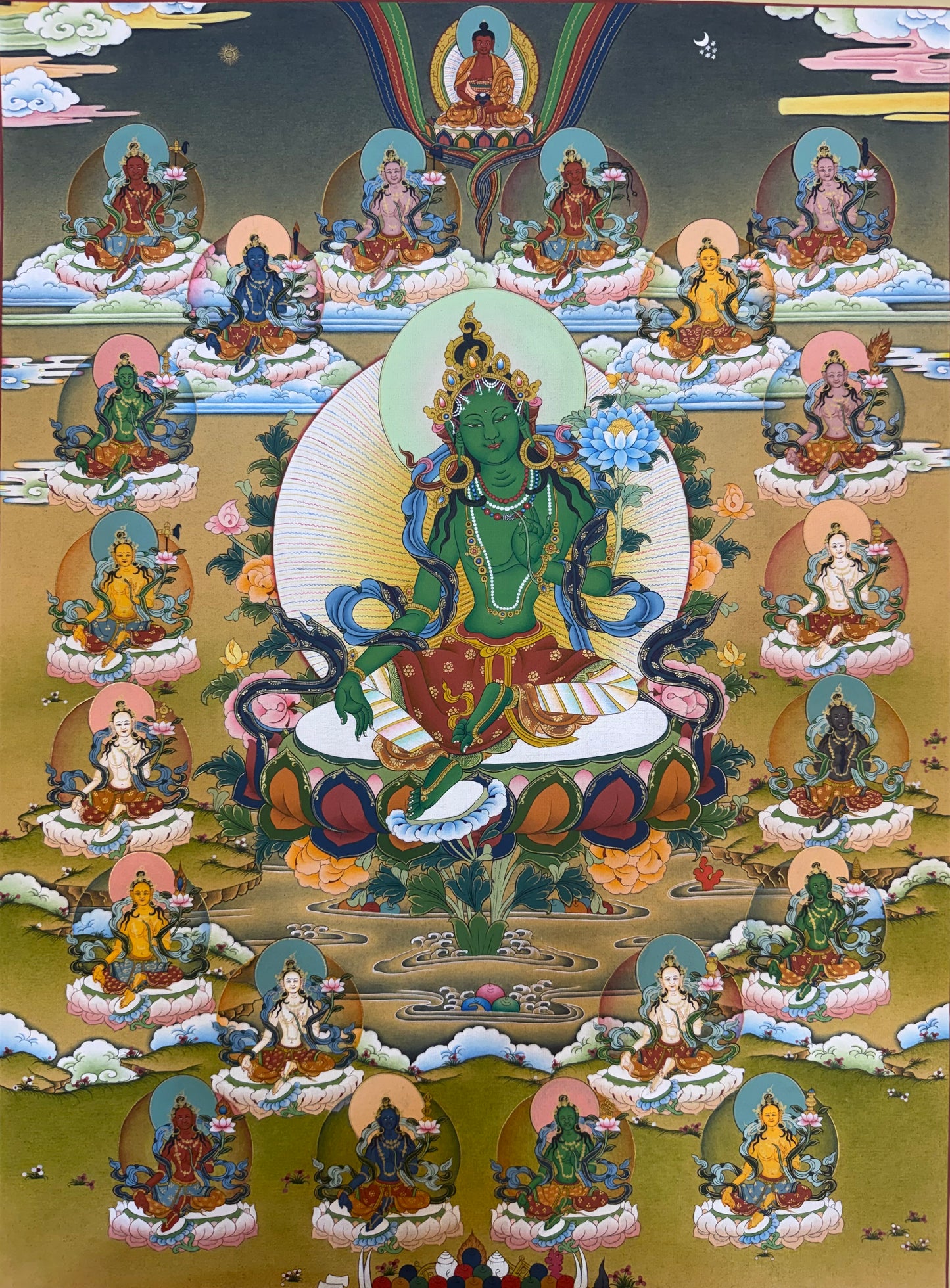 Green Tara thangka painting with central deity and many seated figures around