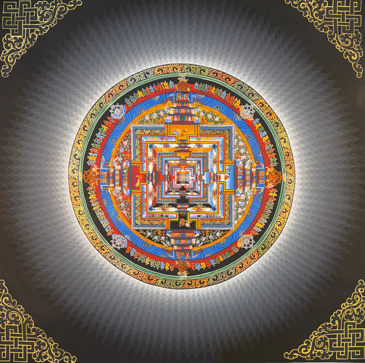 Kalachakra mandala thangka painting with a multicolored geometric design and ornate gold border
